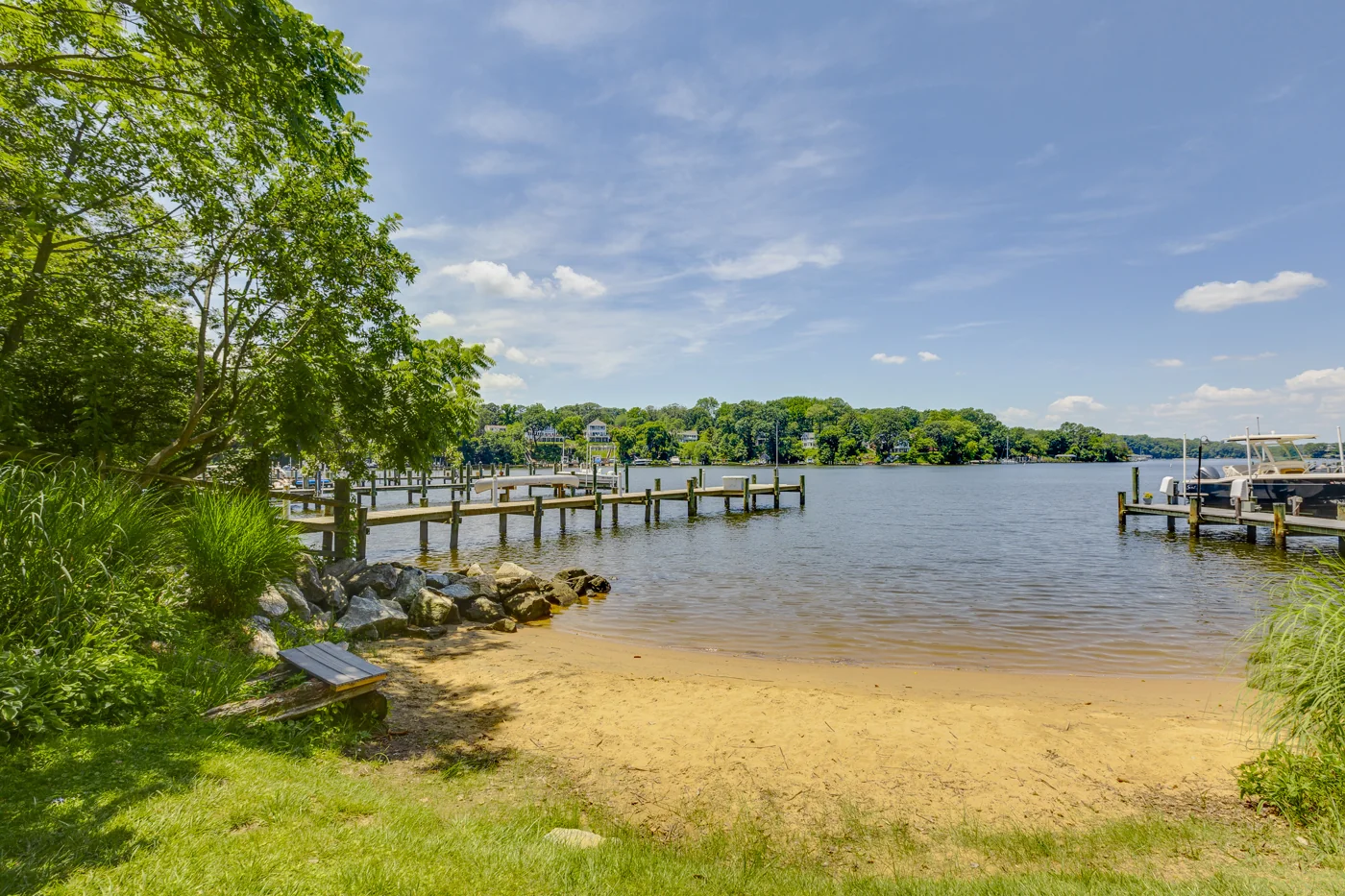 Sandy community beach and piers at Carrollton Manor